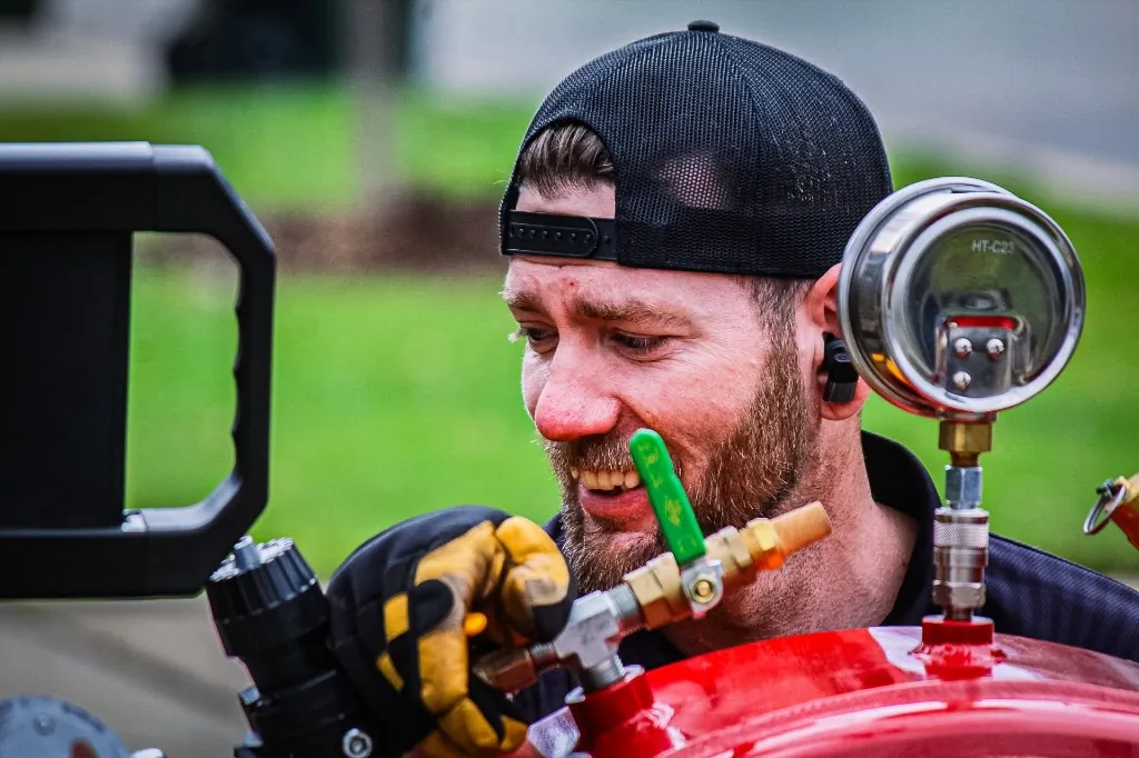 Sean of Legendary Service checking equipment on a service call