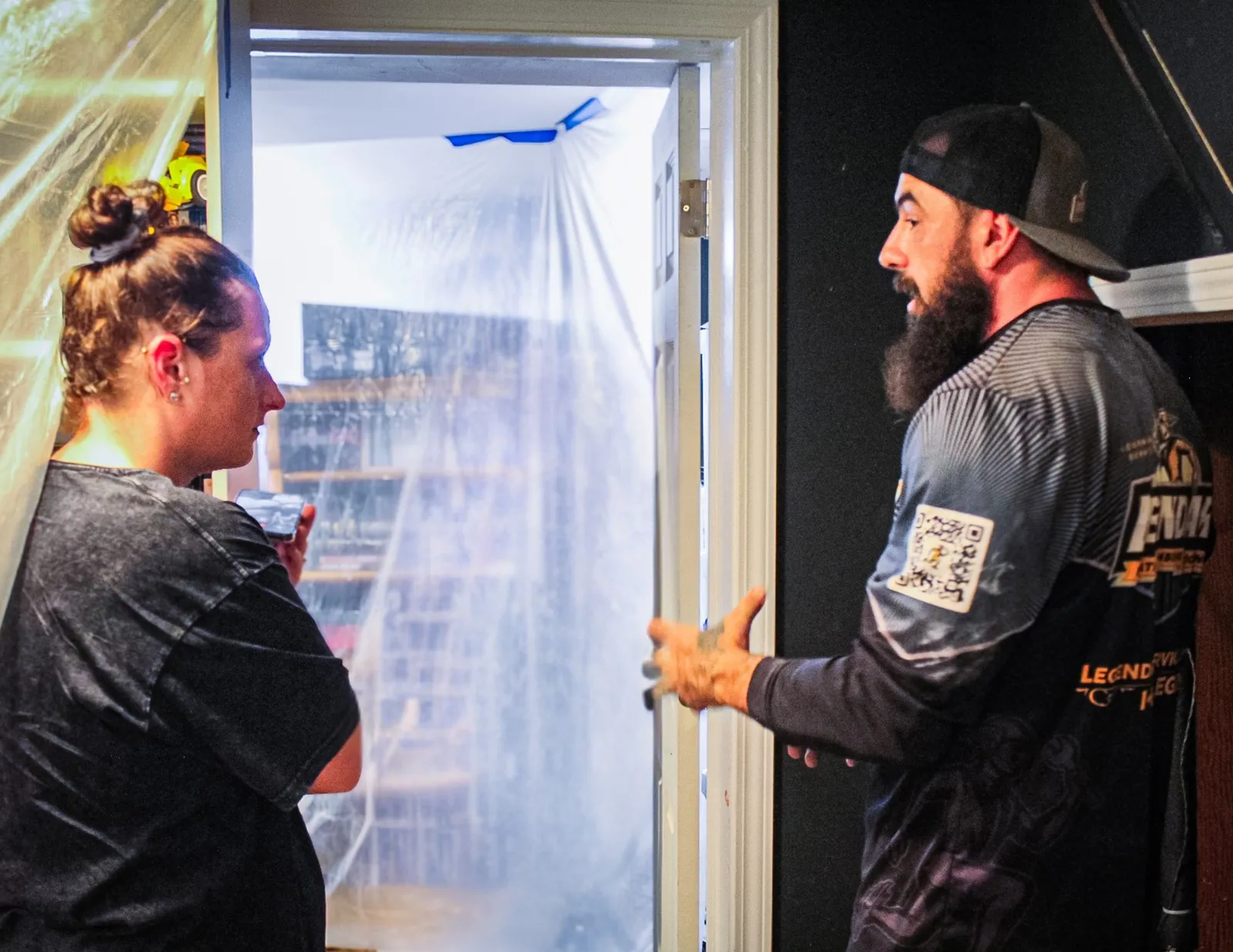 Legendary Service technician explaining work to a homeowner during a service call
