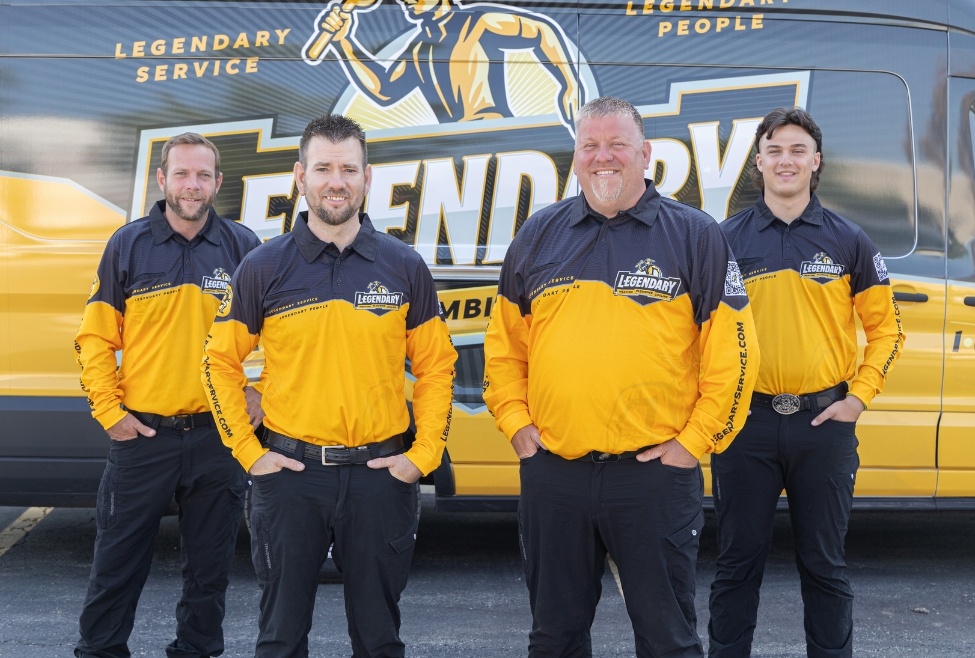 Legendary Service Team: Dedicated plumbers and HVAC technicians posing confidently in front of a branded vehicle, ready to deliver top-notch plumbing, heating and cooling services in Glenview, IL. Trust us for a reliable plumber or HVAC services, including heat pump, furnace and AC repair near me.